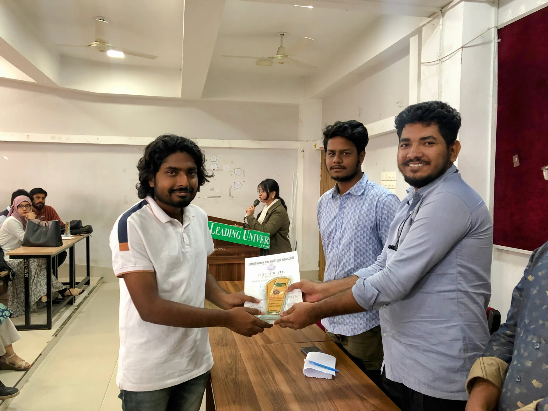 Receiving awards in recognition of my role as Director of Transportation at Leading University Intra Model United Nations 2024.