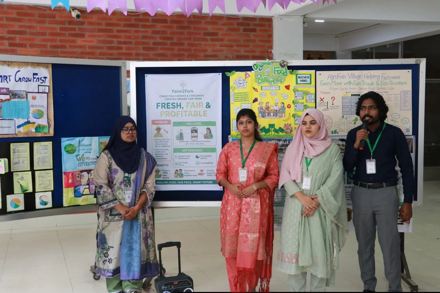 Presenting our business plan to judges and the audience alongside my teammates at the Leading University Business Club’s poster presentation competition.